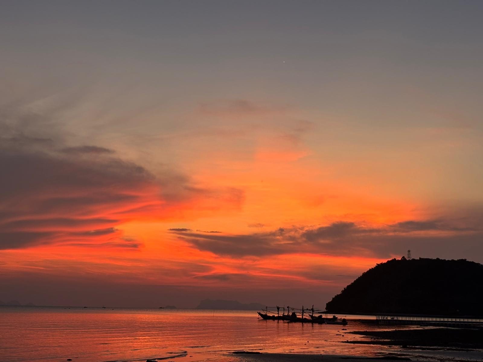 Sunset over the bay at Laem Yai Beach with the headland and fishing boats, seen from Green Heaven Bungalows, Ang Thong, Koh Samui